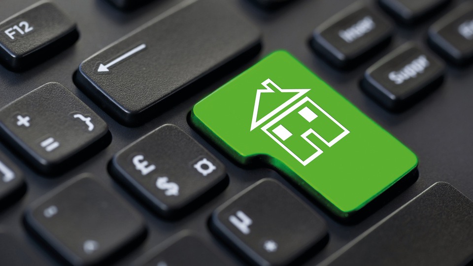 Del av tangentbord där enter-knappen är grön med hus symbol.