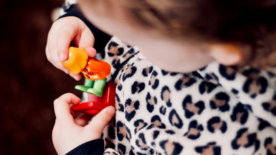 Child playing with toy