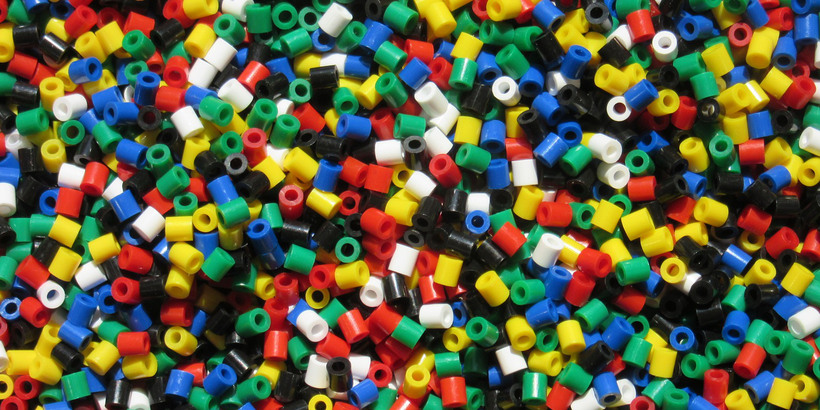 Close-up of colorful plastic beads, used for children's crafts
